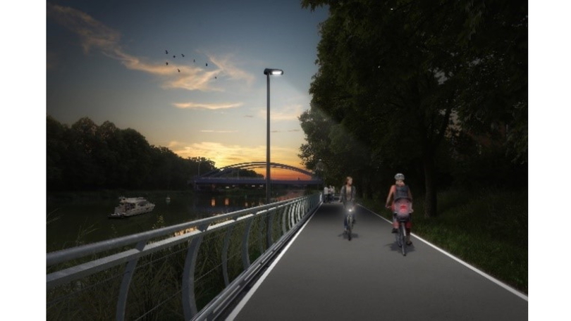 Visualisierung eines beleuchteten Radweges am Ufer eines Flusses. Auf dem Radweg begegnen sich zwei Radfahrende. Visualisierung eines beleuchteten Radweges am Ufer eines Flusses. Auf dem Radweg begegnen sich zwei Radfahrende.