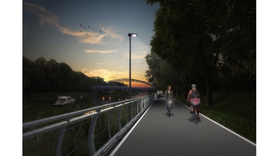 Zum Artikel Visualisierung eines beleuchteten Radweges am Ufer eines Flusses. Auf dem Radweg begegnen sich zwei Radfahrende.