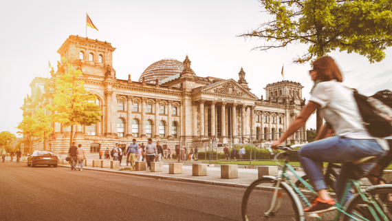 Berlin urban city life with Reichstag at sunset in summer, Germany Berlin urban city life with Reichstag at sunset in summer, Germany