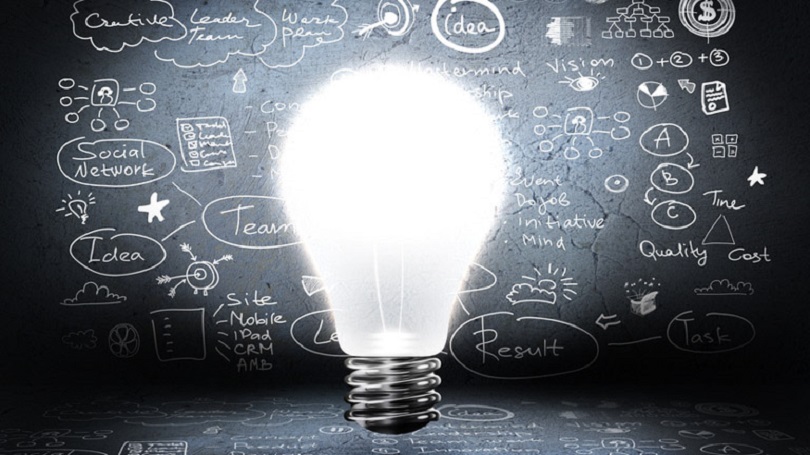 Lightbulb in front of a board Lightbulb in front of a board
