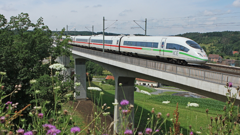 An ICE 3 of the 403 class is crossing the Aurach river near Emskirchen An ICE 3 of the 403 class is crossing the Aurach river near Emskirchen